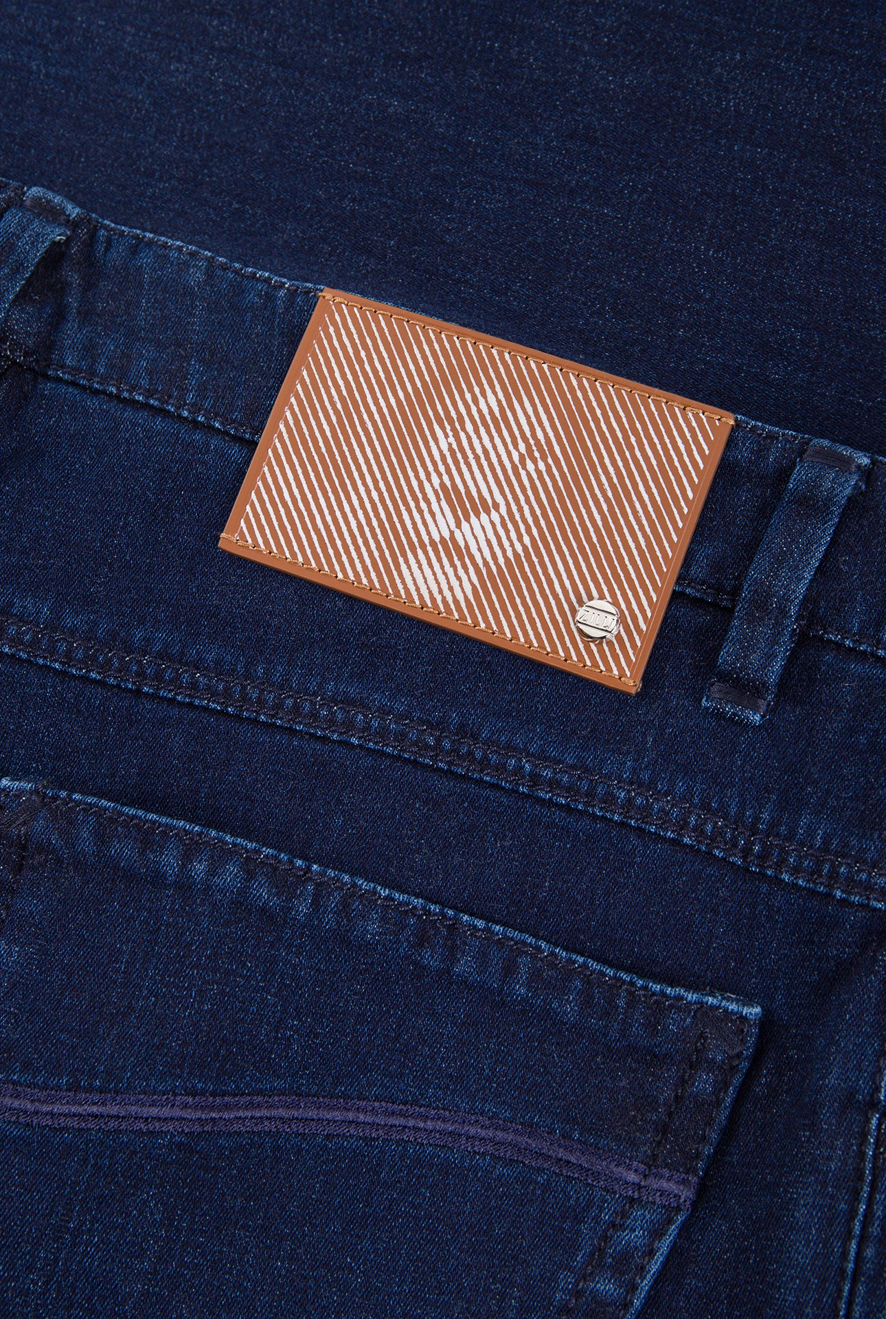 Джинсы облегающего кроя с нашивкой в виде льва